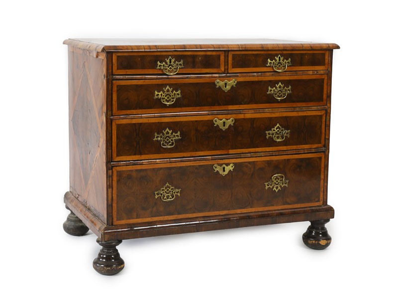 A William and Mary oyster veneered laburnum and walnut chest