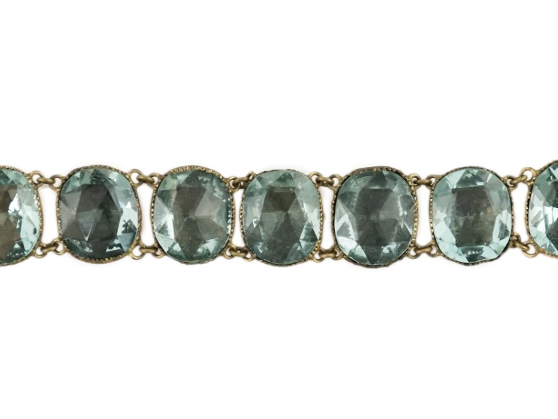 A rare 18th century 'Queen Anne' gilt metal and foil backed aquamarine paste bracelet